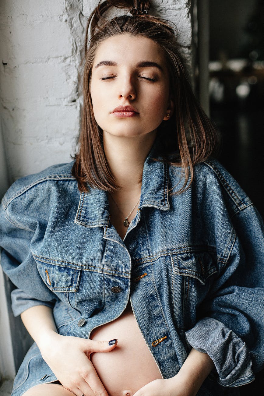 woman in blue denim button up jacket